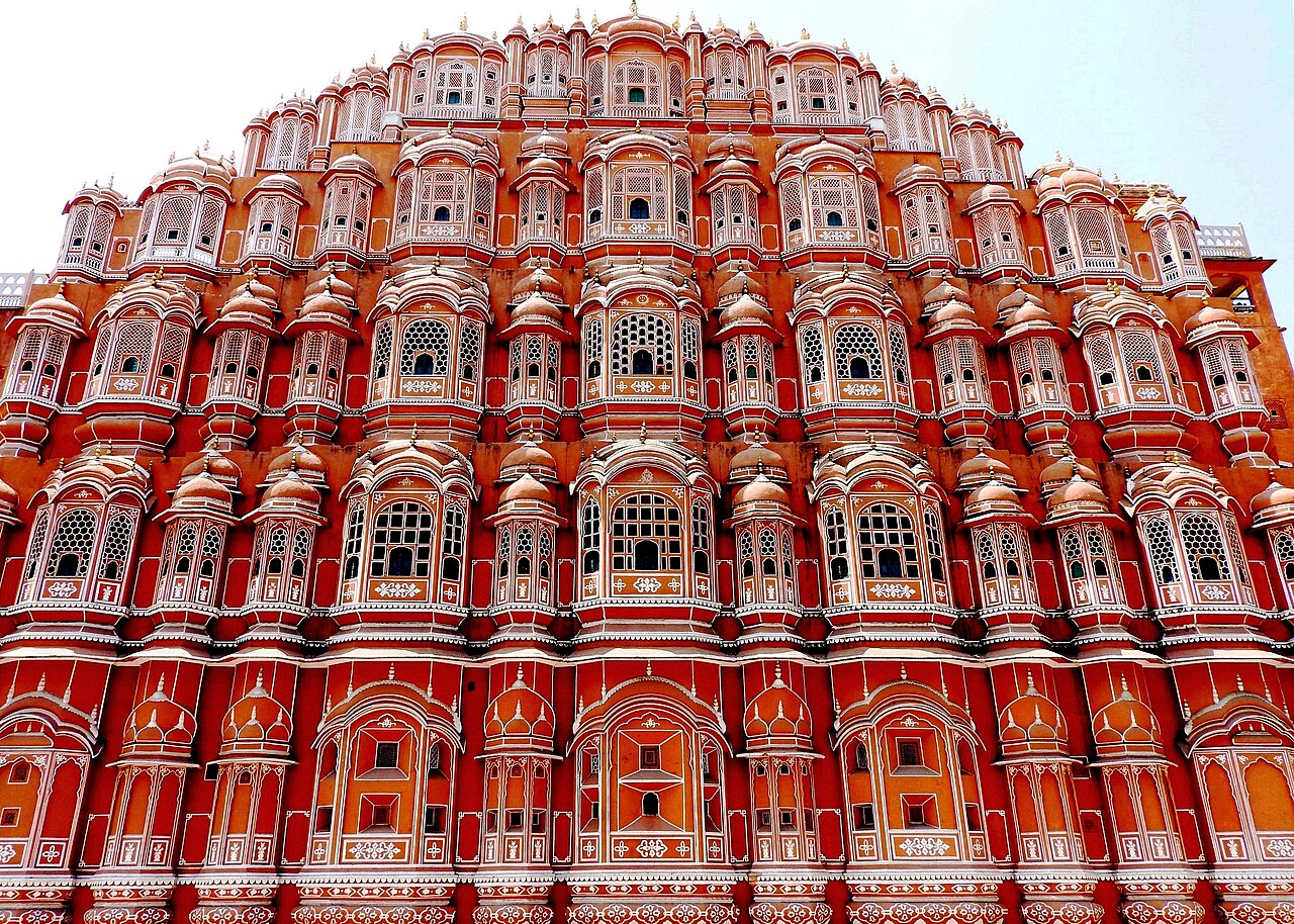 The ornate pink and red facade of Hawa Mahal in Jaipur.