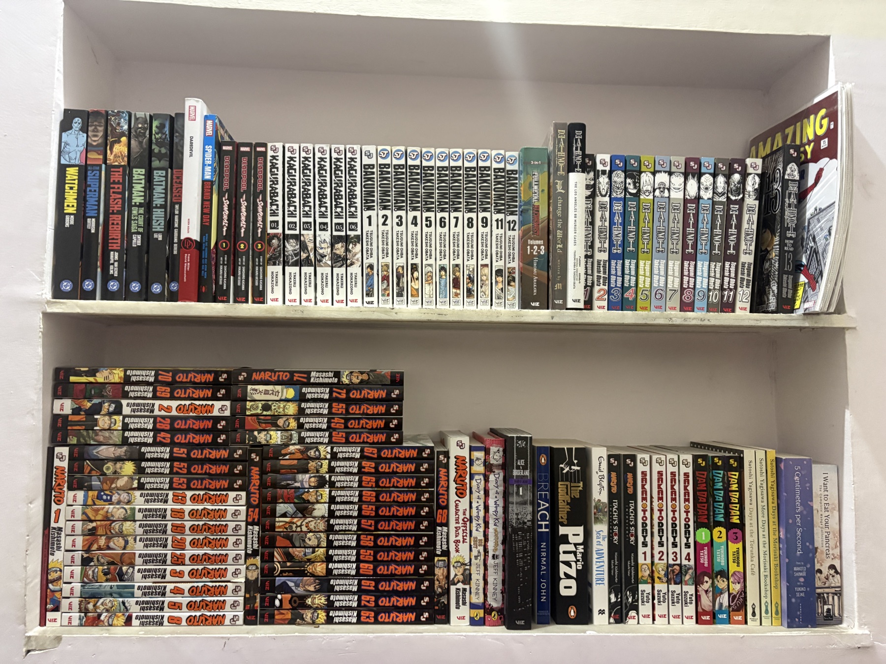 Shubham's manga and book collection arranged across two shelves